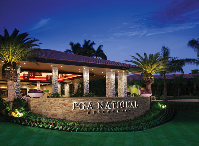Front sign of PGA National Golf Club at night
