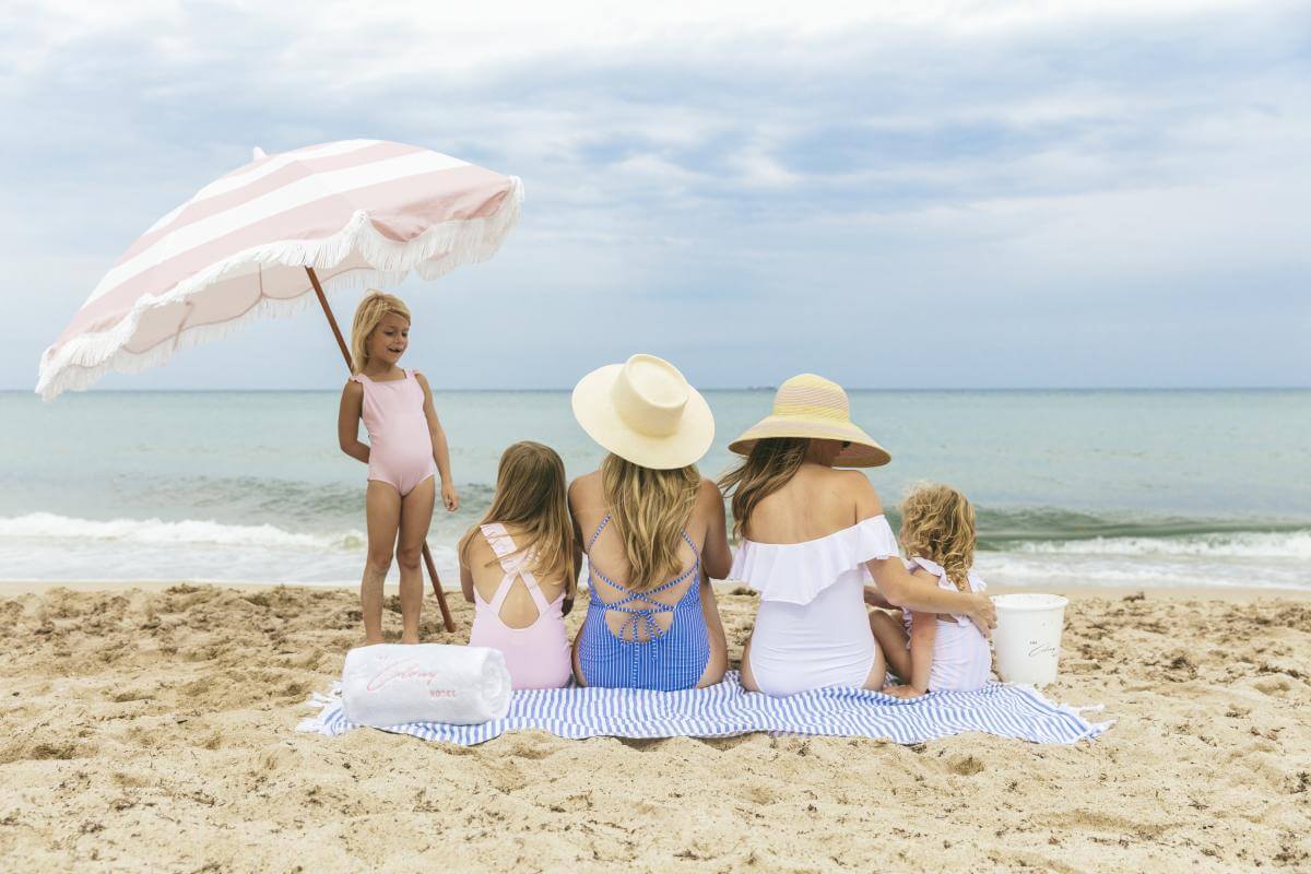 Family on the beach near The Colony Palm Beach