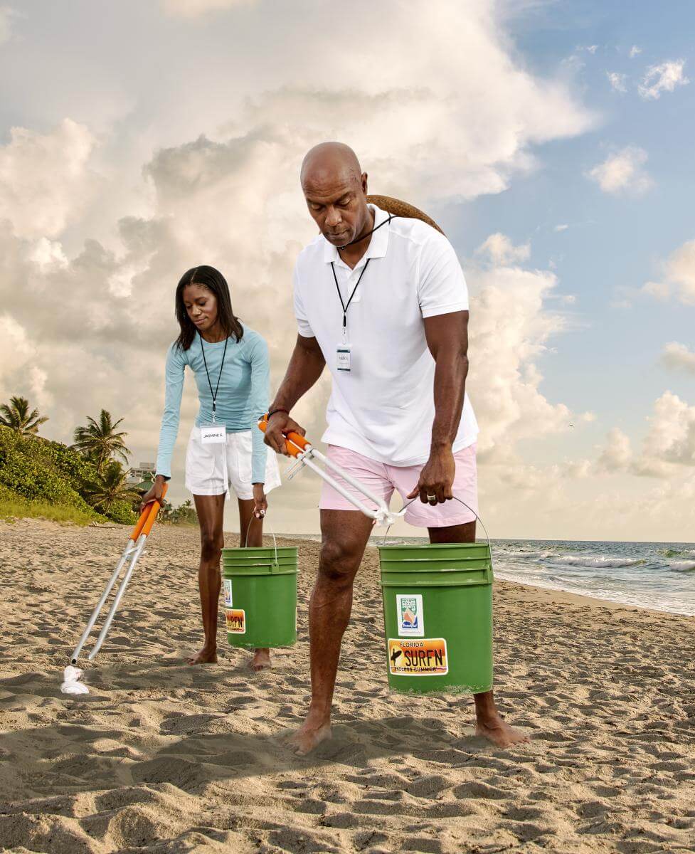 Couple cleaning the beach