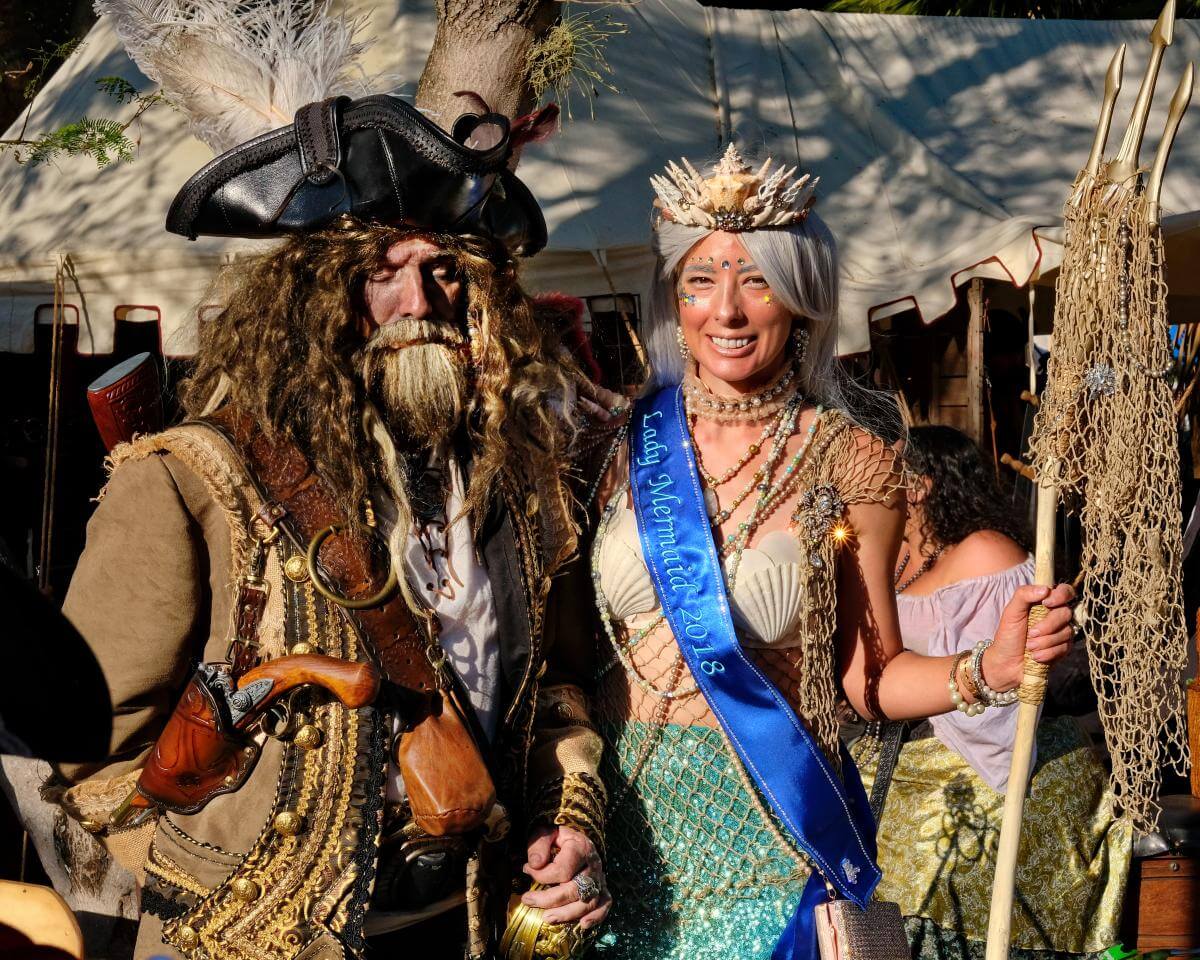Man dressed like pirate and women dressed as a mermaid
