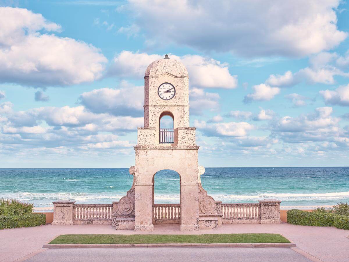 Clock tower in front of the ocean on Worth Avenue