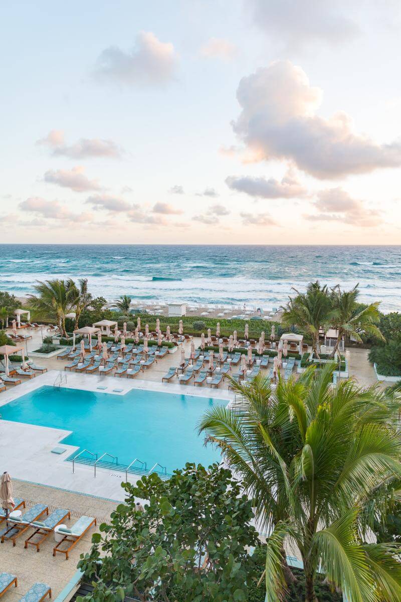 Overhead veiw of a ppol and the ocean beyond at the Four Seasons Palm Beach.