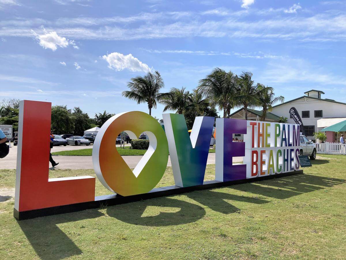The Palm Beaches logo in rainbow colors