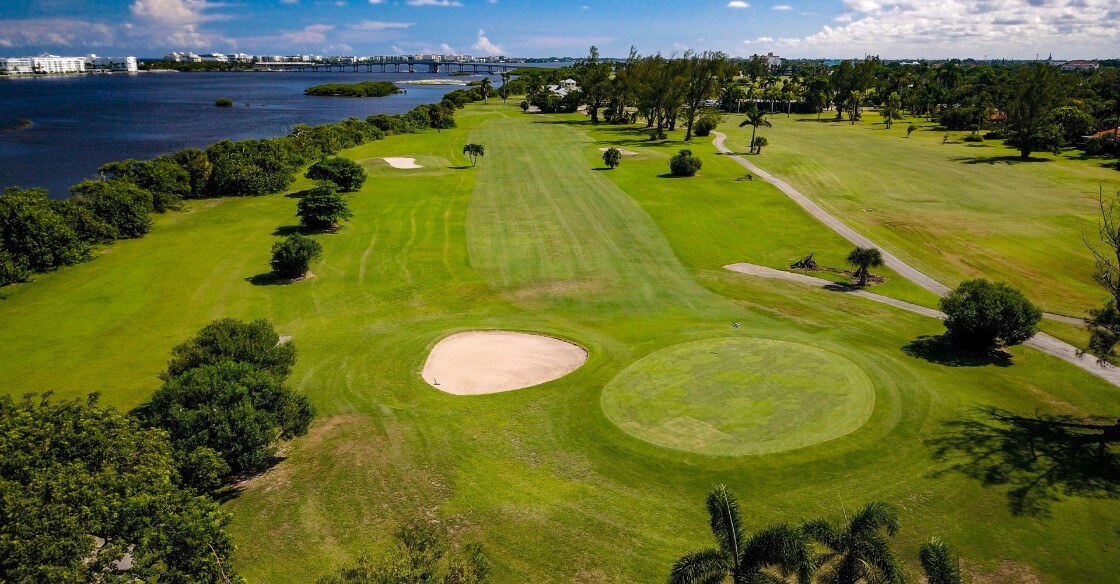 Aerial view of a golf course along the water