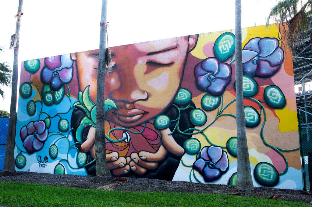 Child holding seedlings mural