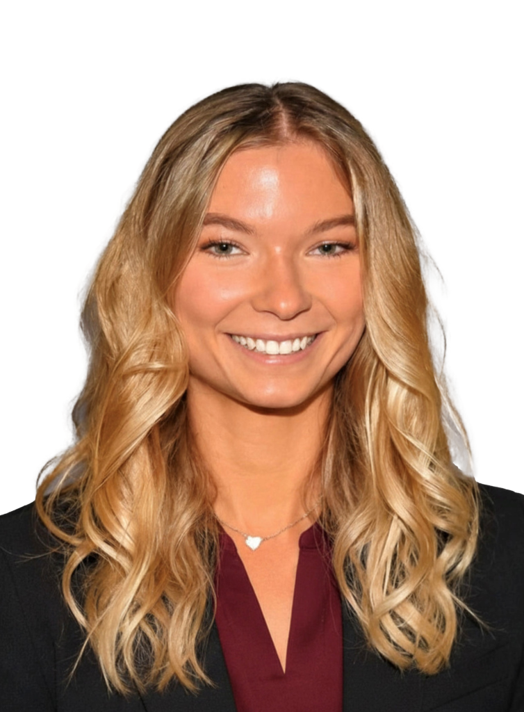 A smiling young woman with long blonde hair wearing a professional blazer