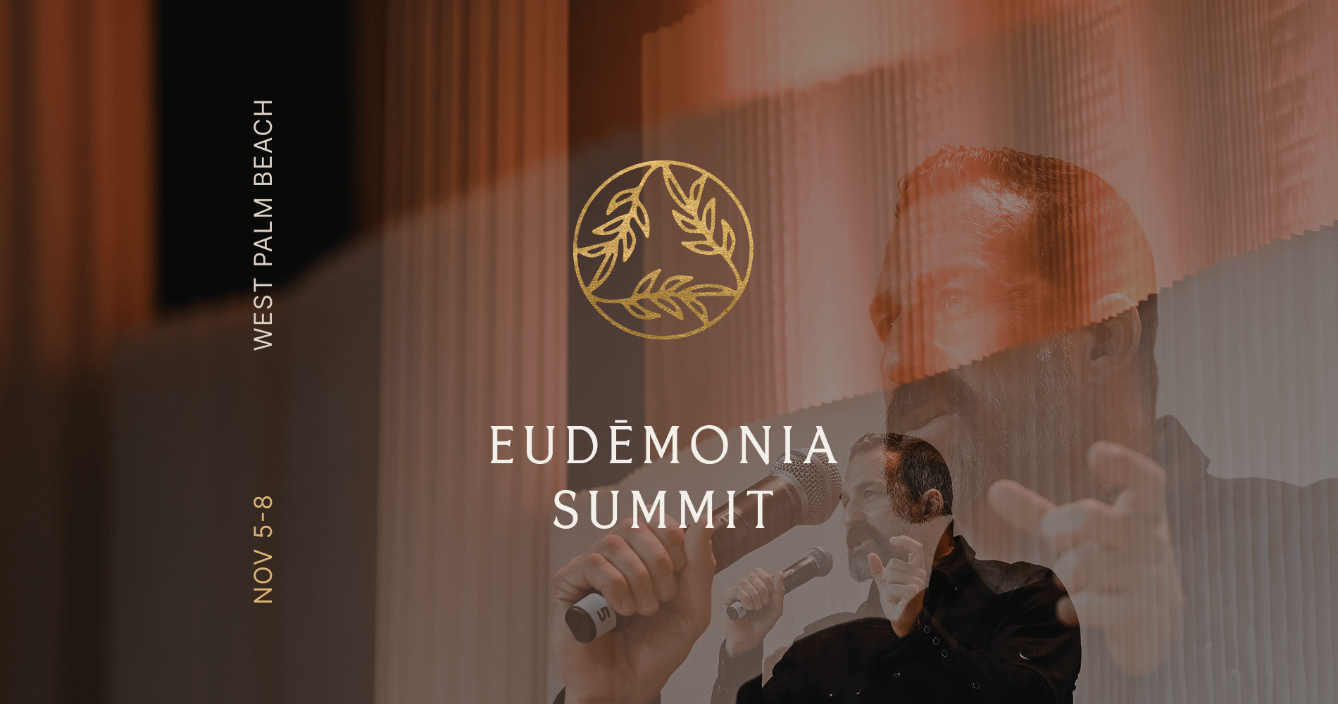 A man holding a microphone stands before a golden emblem and the words 'Eud&Atilde;&copy;monia Summit' at West Palm Beach