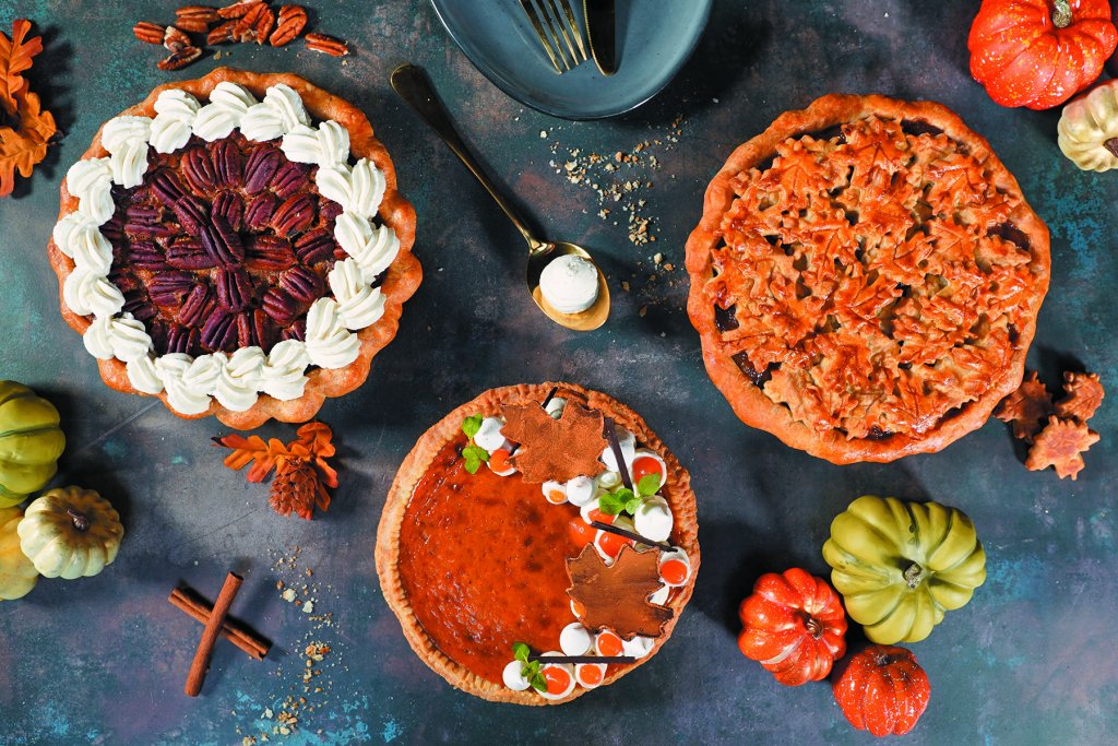 Three pumpkin pies on a table