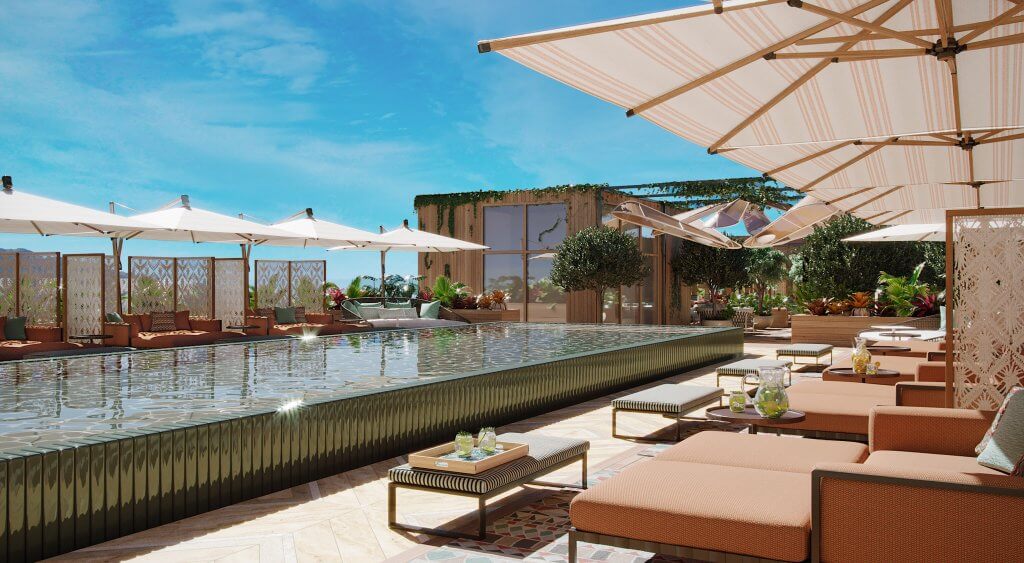 Une piscine luxueuse sur le toit avec des cabanas, des chaises longues et une végétation luxuriante sous un ciel bleu limpide.