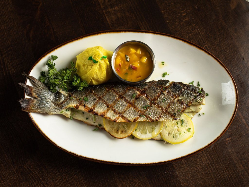 Branzino plate at Corvina Seafood Grill