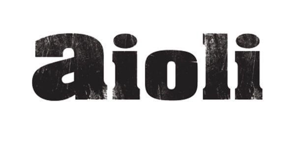 The word 'aioli' written in a distressed, hand-painted style font