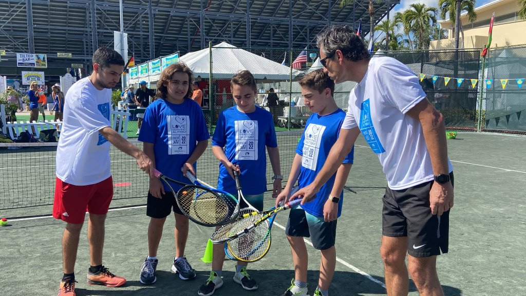 three kids and two tennis coaches at the delray beach open