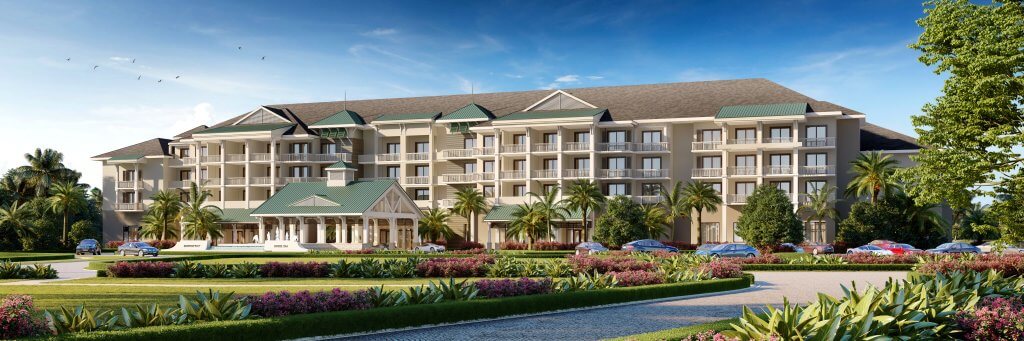 Un complexe luxueux avec une entrée grandiose, entouré de jardins luxuriants et de palmiers.