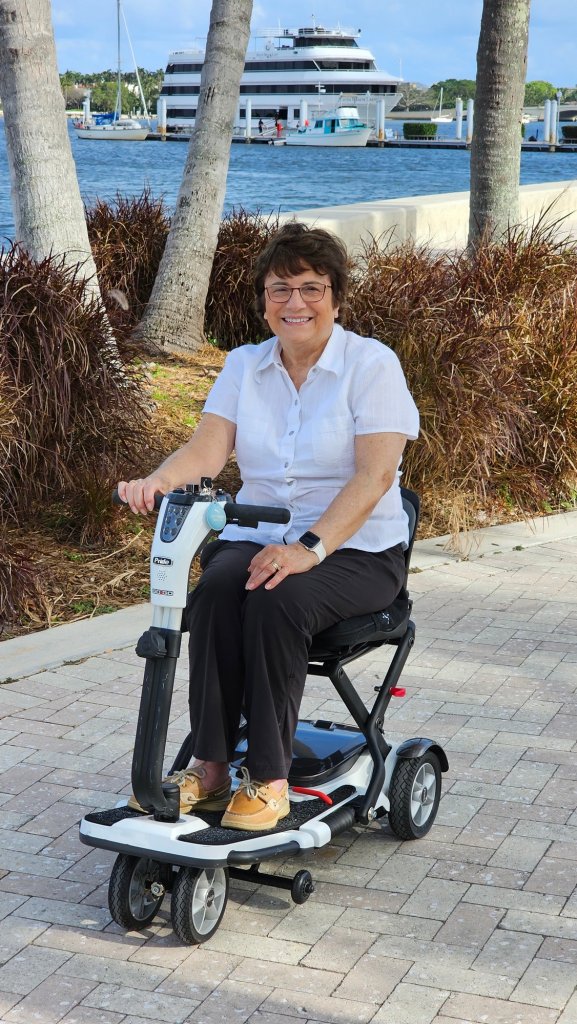 Rosemarie on her scooter on the West Palm Beach waterfront